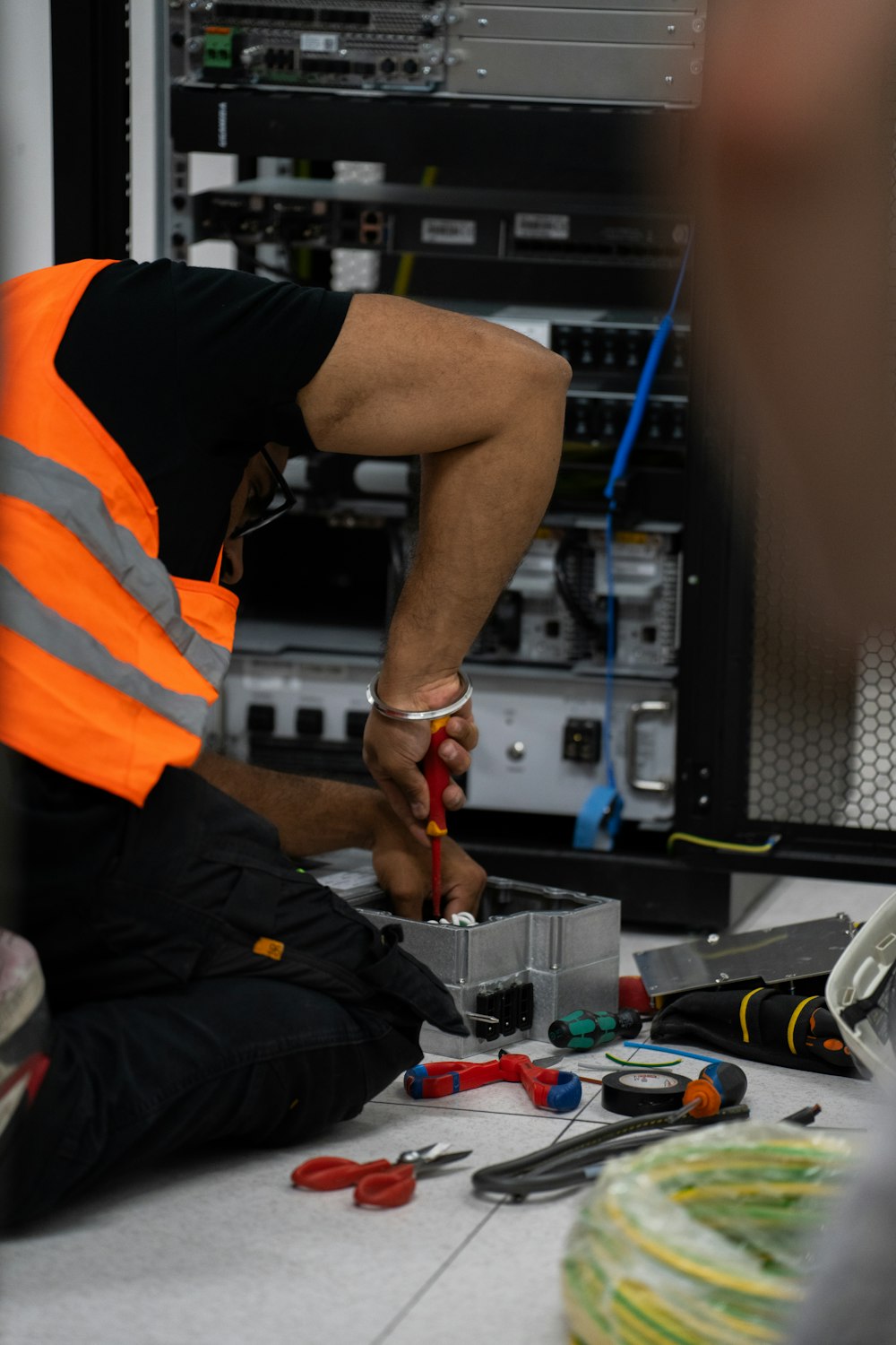 Kiwi Security technician repairing equipment on site